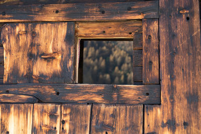 Full frame shot of old wooden log cabin