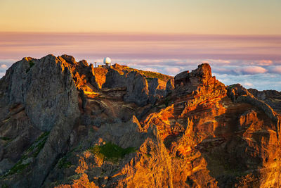 Scenic view of mountains against sky during sunset