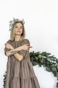 A young woman with blonde hair with a christmas tree. new year's concept,christmas decorations.