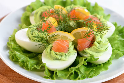 Eggs stuffed with avocado, salmon and lemon. the perfect appetizer for your holiday table.