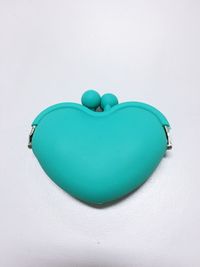 Close-up of heart shaped balloons against white background