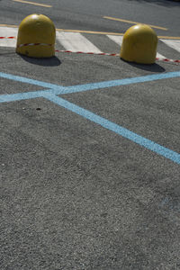 Yellow umbrella on road