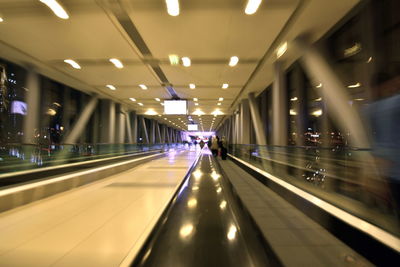 Illuminated underground walkway in airport