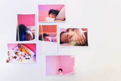 High angle view of woman on pink table against wall