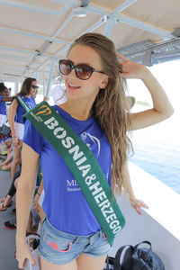 Portrait of young woman wearing sunglasses