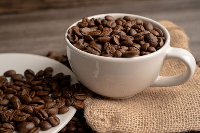 Close-up of roasted coffee beans on table