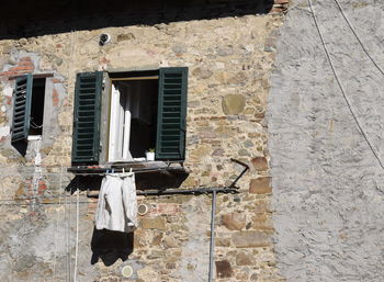 Low angle view of window on old building