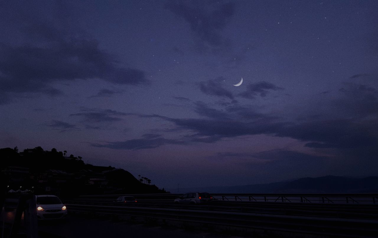 SILHOUETTE OF ROAD AGAINST CLOUDY SKY AT DUSK