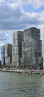 Buildings in city against sky