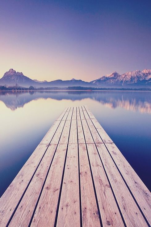 water, lake, pier, tranquil scene, wood - material, tranquility, blue, scenics, jetty, beauty in nature, reflection, boardwalk, wooden, clear sky, wood, nature, mountain, idyllic, calm, sky