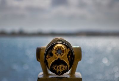 Close-up of old rusty coin-operated binoculars