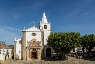 View of bell tower against cloudy sky