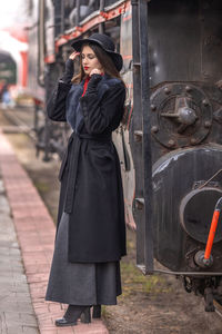 Rear view of woman standing in city