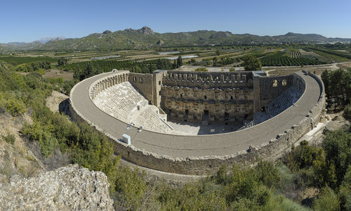 High angle view of castle on mountain against sky