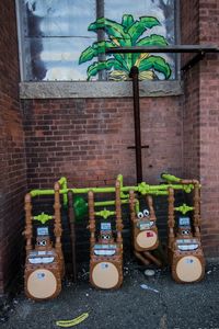 Close-up of plants against brick wall