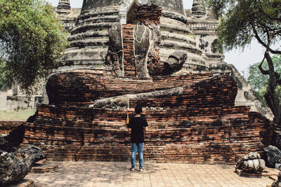 Full length of man outside temple against building