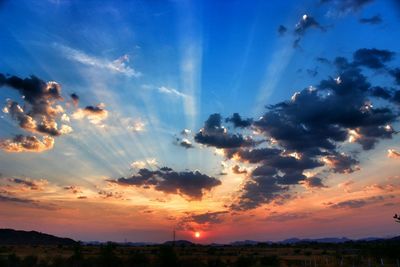 Scenic view of landscape against cloudy sky