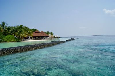 Scenic view of sea against blue sky