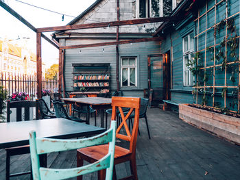 Empty chairs and tables in restaurant