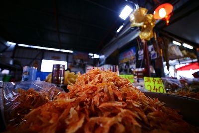 Close-up of dried shrimps heap at market stall