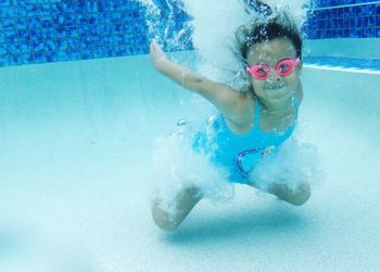 Girl swimming in pool