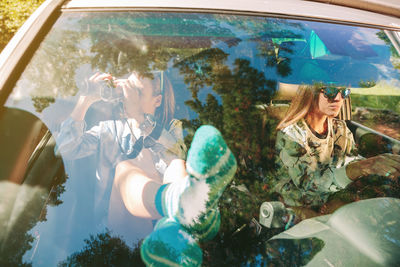 Panoramic view of people in car