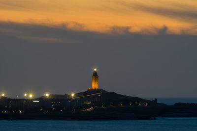 Illuminated city at night, tower of hercules at night, a coruña skyline at night