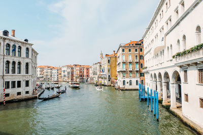 Canal passing through buildings in city