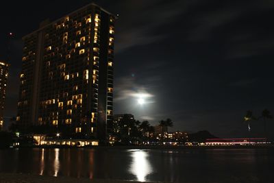 Illuminated buildings in city at night