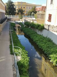 High angle view of swimming pool by buildings in city