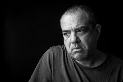 Sad adult male close-up. black and white portrait