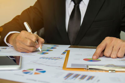 Close-up of man working on table