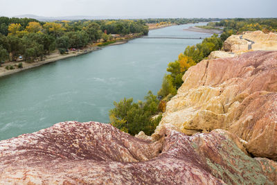 Scenic view of rocks by lake