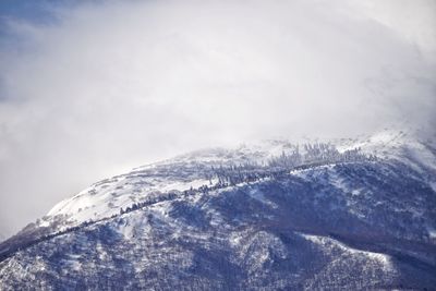 Scenic view of snow covered mountain against sky