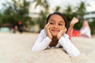 Cute girl smiling at beach