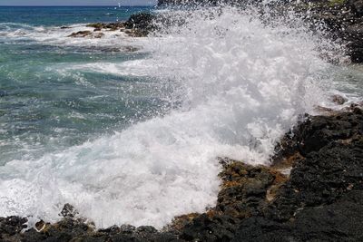 Waves splashing on shore