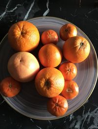 Close-up of oranges in plate