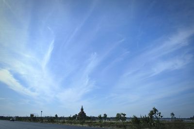 Panoramic view of landscape against blue sky