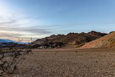 Scenic view of desert against sky during sunset