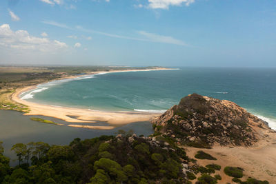 Aerial view of seascape with tropical sandy beach and blue ocean. elephant rock, sri lanka.