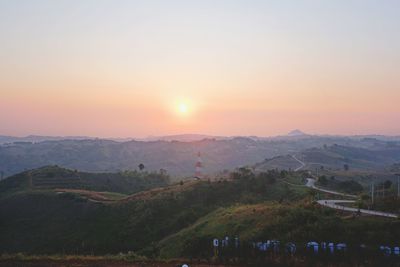 Scenic view of landscape against sky during sunset