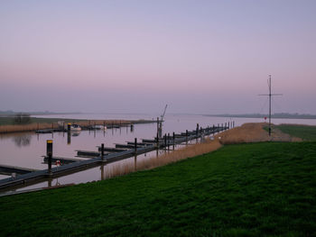 Scenic view of lake against sky during sunset