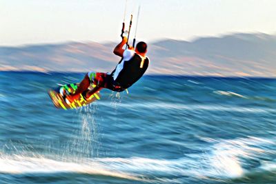 People surfing in sea