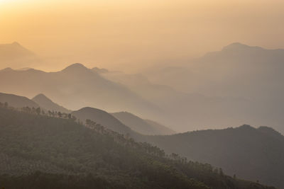 Scenic view of mountains against sky during sunset