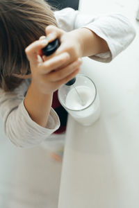 Midsection of woman using mobile phone