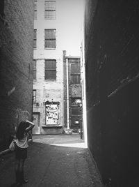 Woman standing in front of building