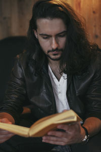 Portrait of young man sitting outdoors