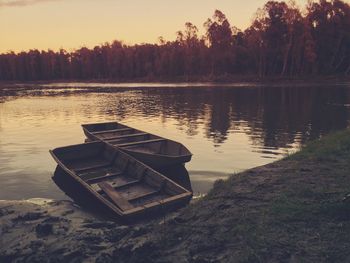 Scenic view of calm lake at sunset