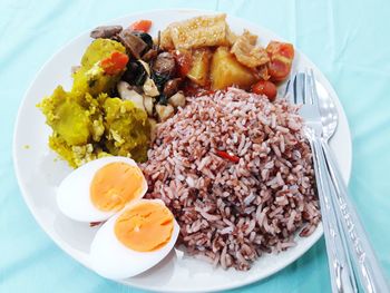 High angle view of breakfast served on table