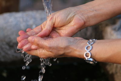Close-up of person washing hands